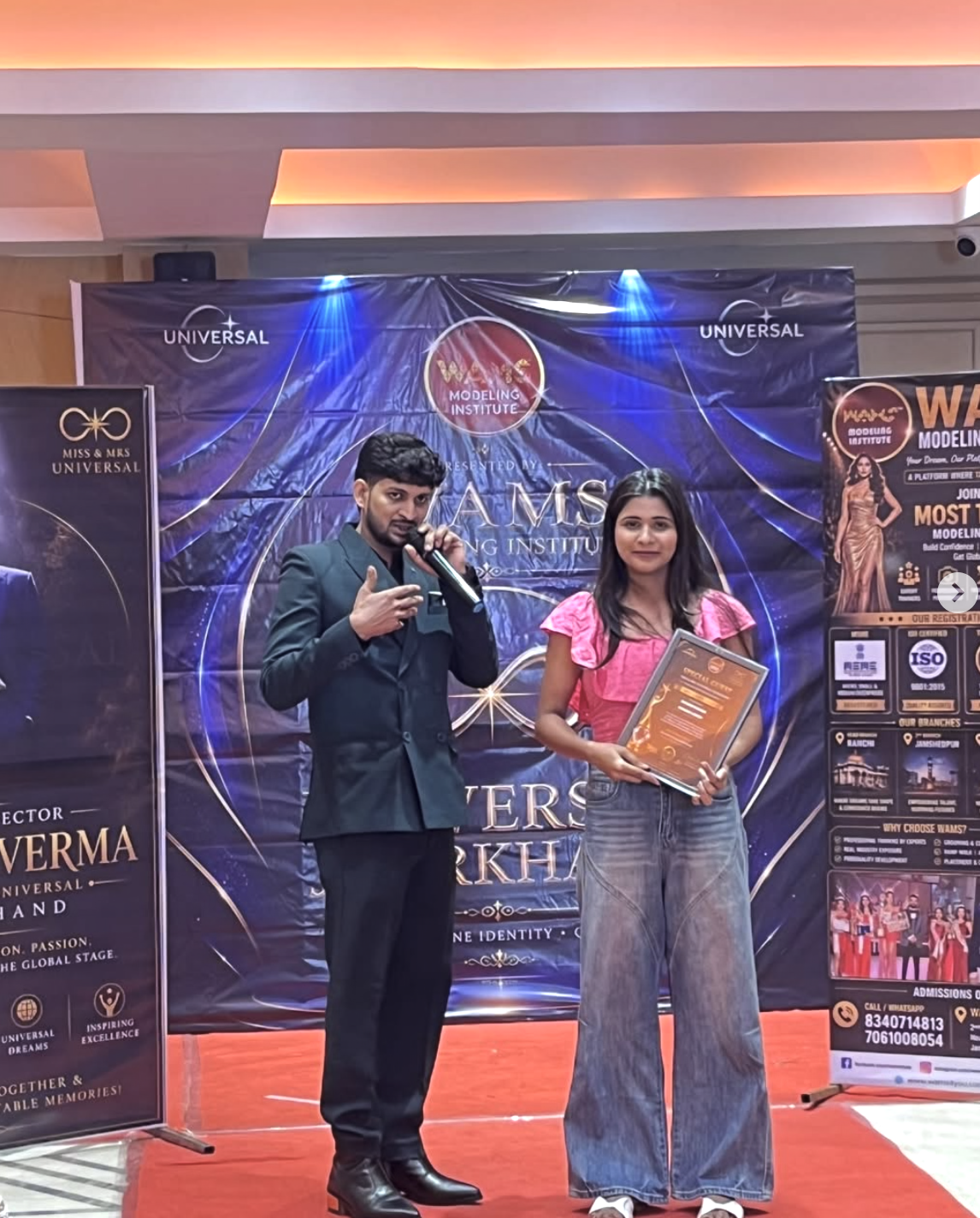 Shalinee receiving award at Miss & Mrs Universal Jharkhand by WAMS Modeling Institute